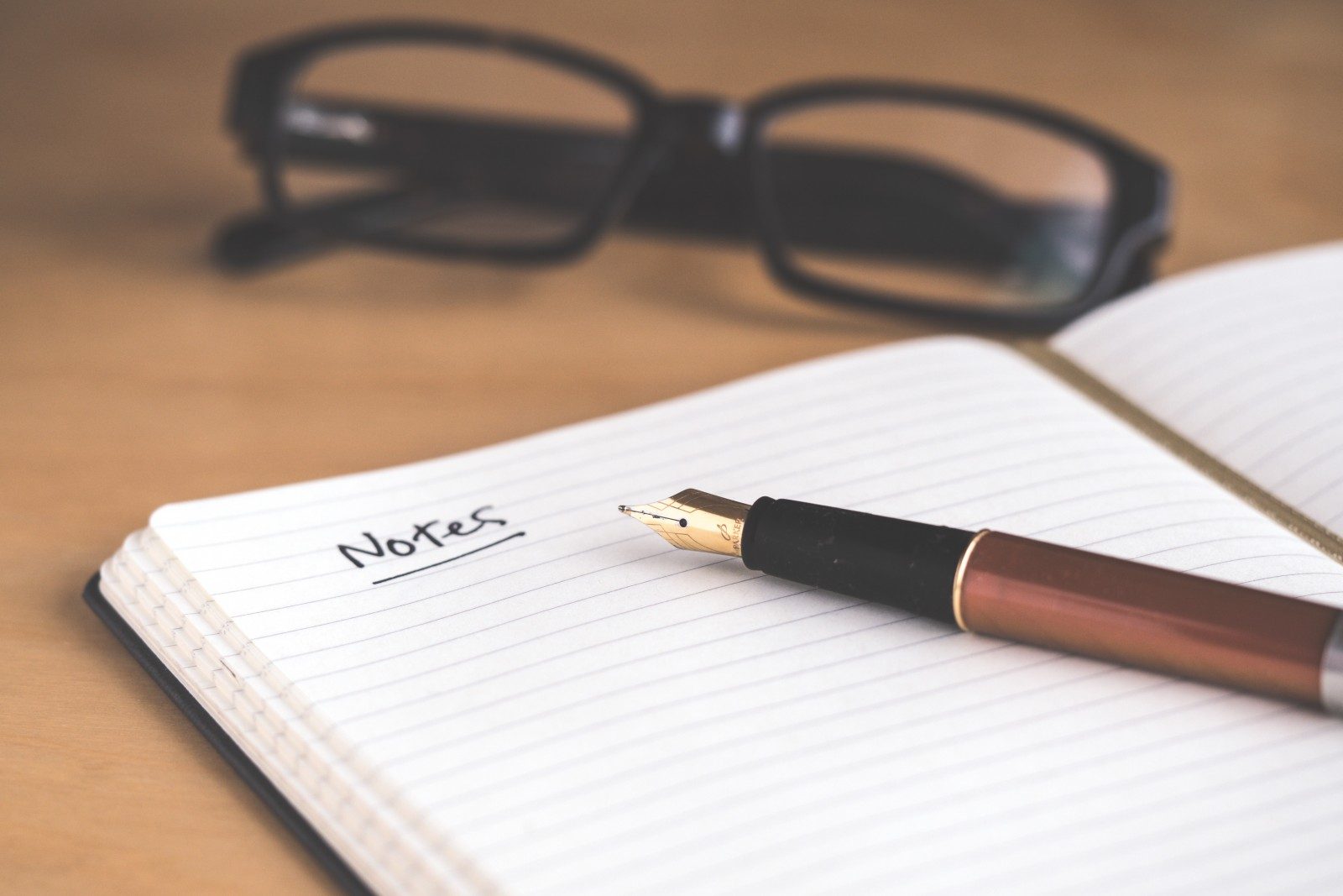 Photo by David Travis brown fountain pen on notebook
